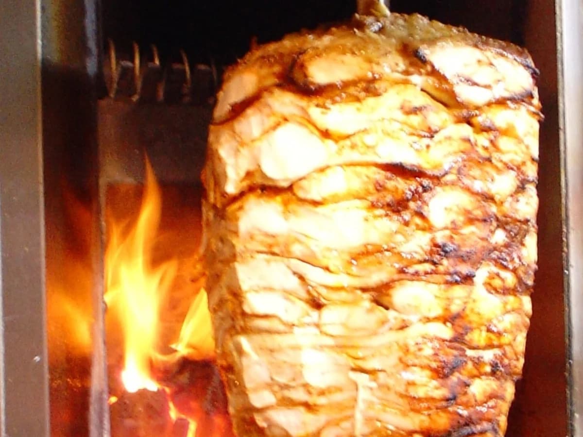 Close-up of a skewer made from layered pieces of meat