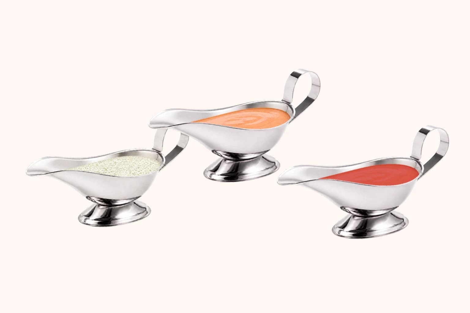Three sauce boats with herb, cocktail and hot kebab sauces